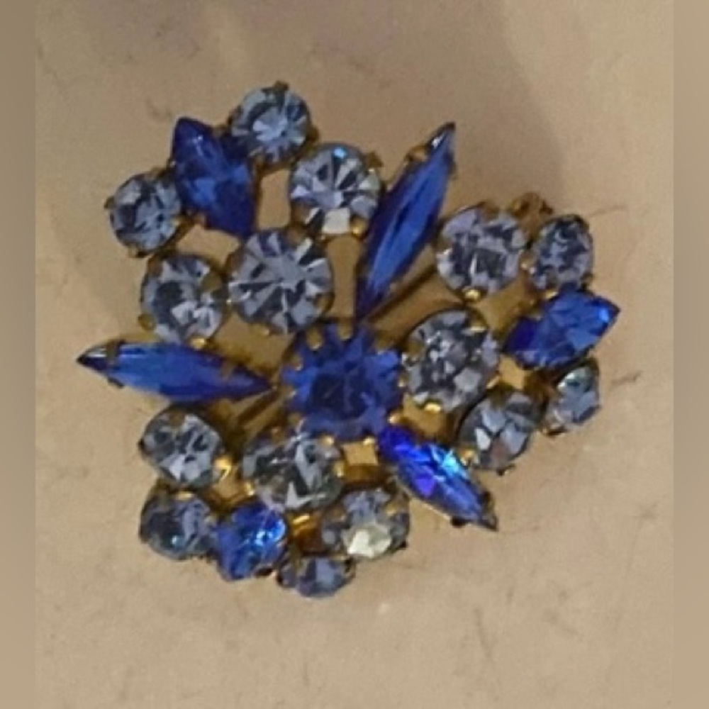 Vintage blue coloured crystals on a gold cluster frame